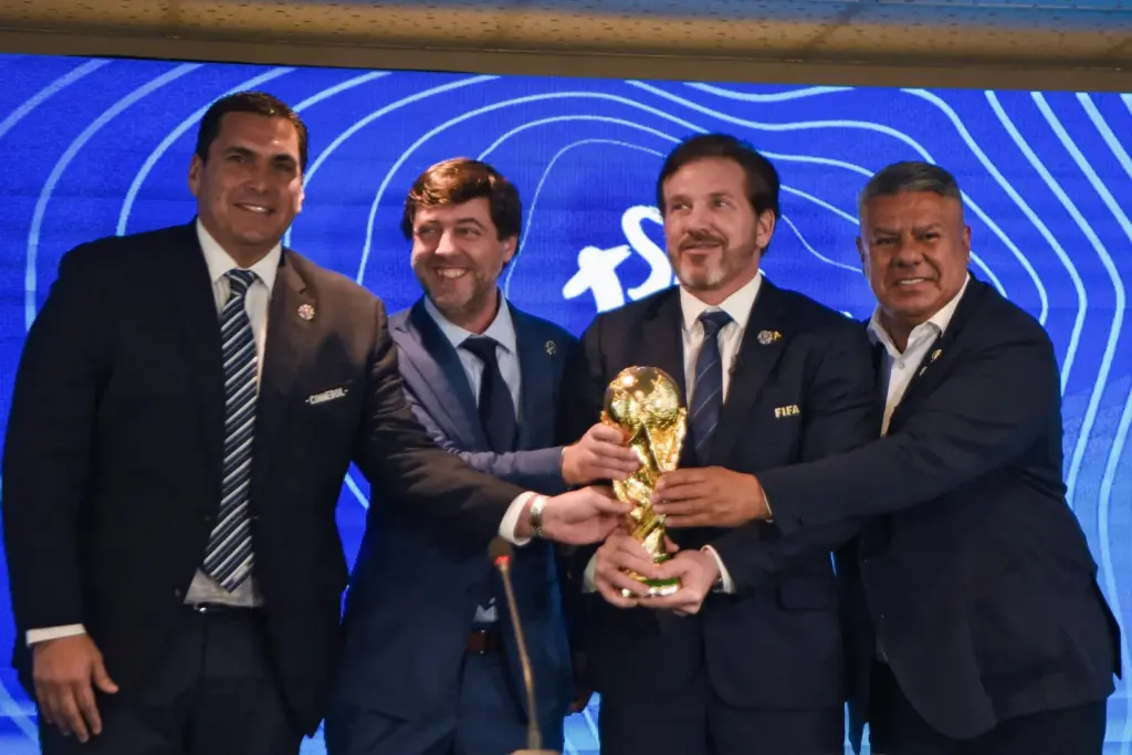Conmebol executives with the World Cup trophy.