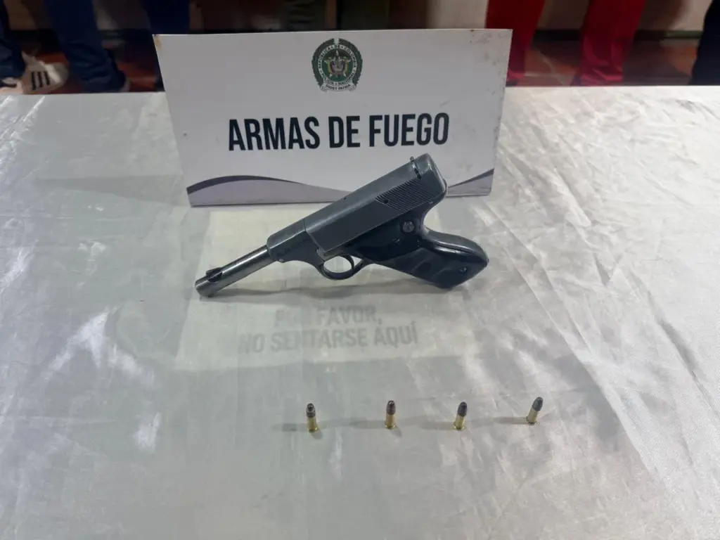 The firearm was hidden in a suitcase inside the vehicle.